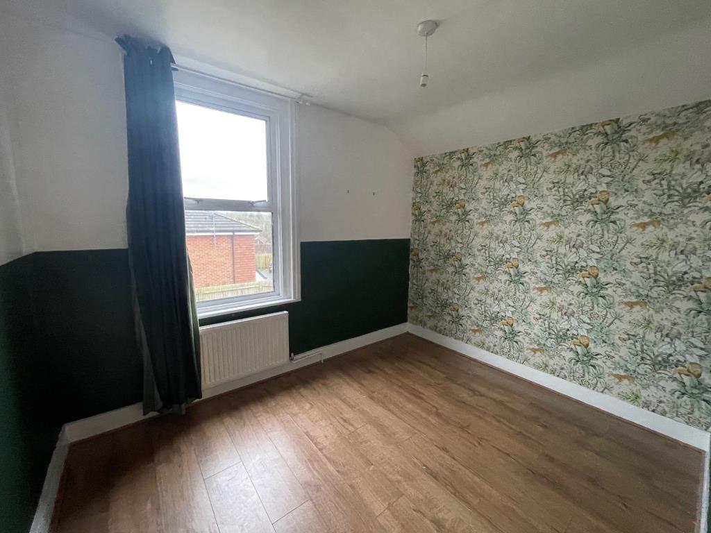 Lot: 3 - THREE-BEDROOM HOUSE IN POPULAR LOCATION - Bedroom 3 with window overlooking the garden